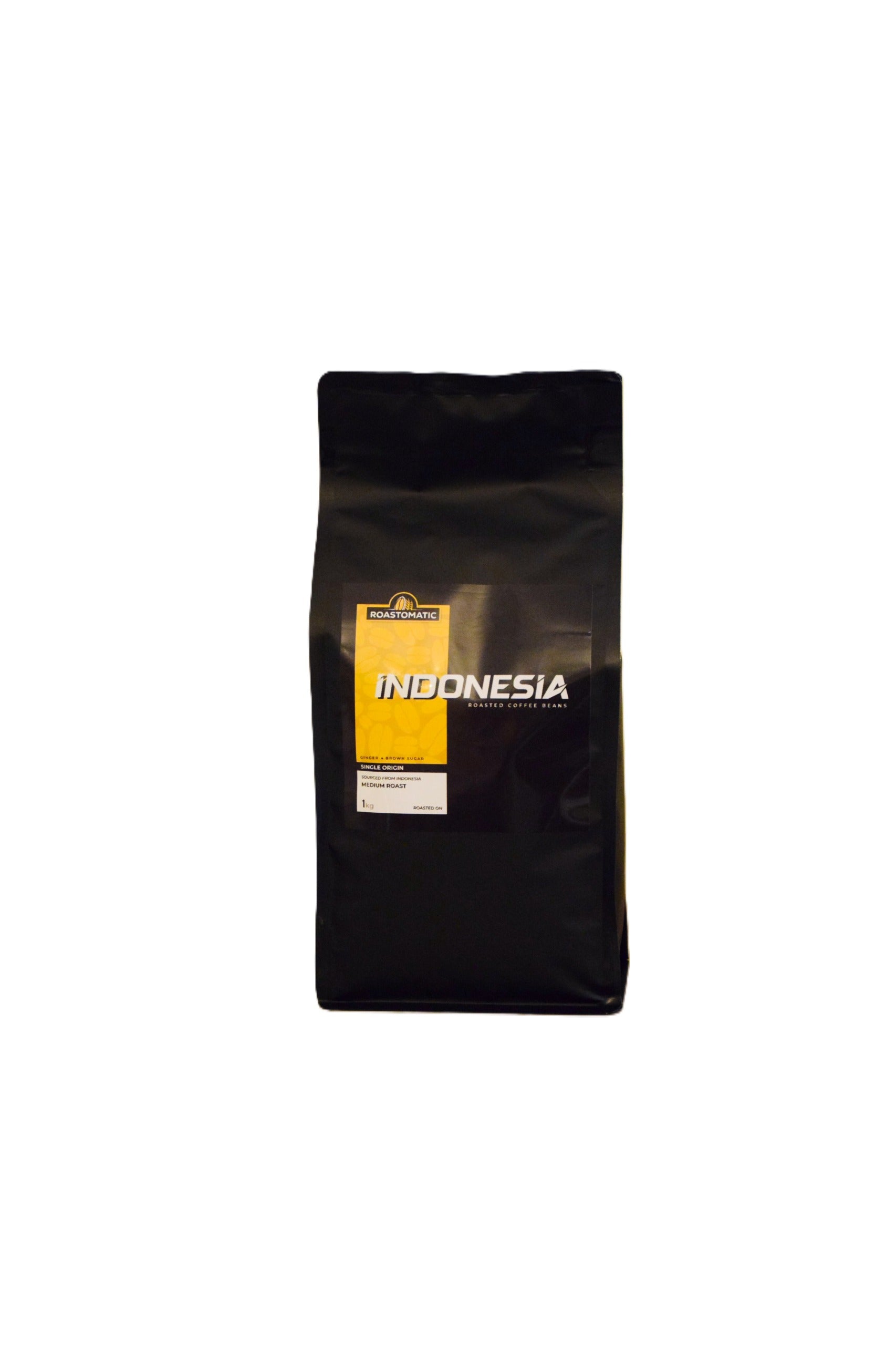 Black coffee bag of roasted coffee beans from Roastomatic with 'Indonesia' label on a white background 